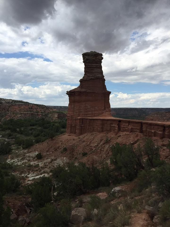 The Lighthouse rock formation at Palo Duro Canyon State Park under a cloudy sky